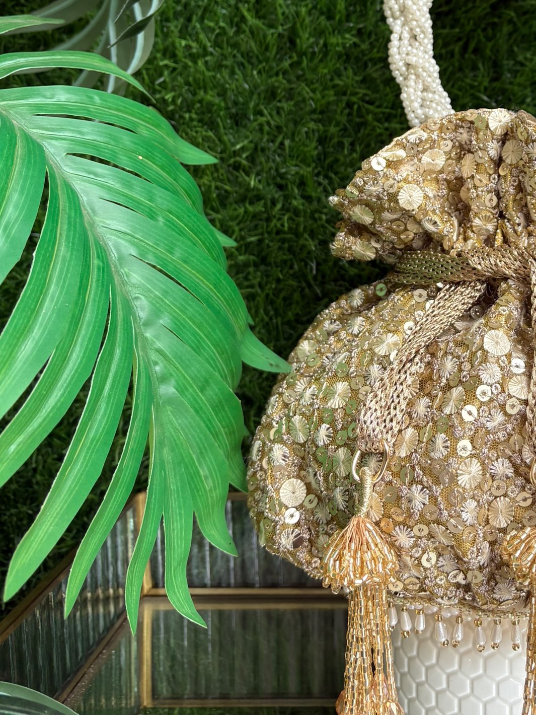 Designer golden potli bag for weddings and festive occasions