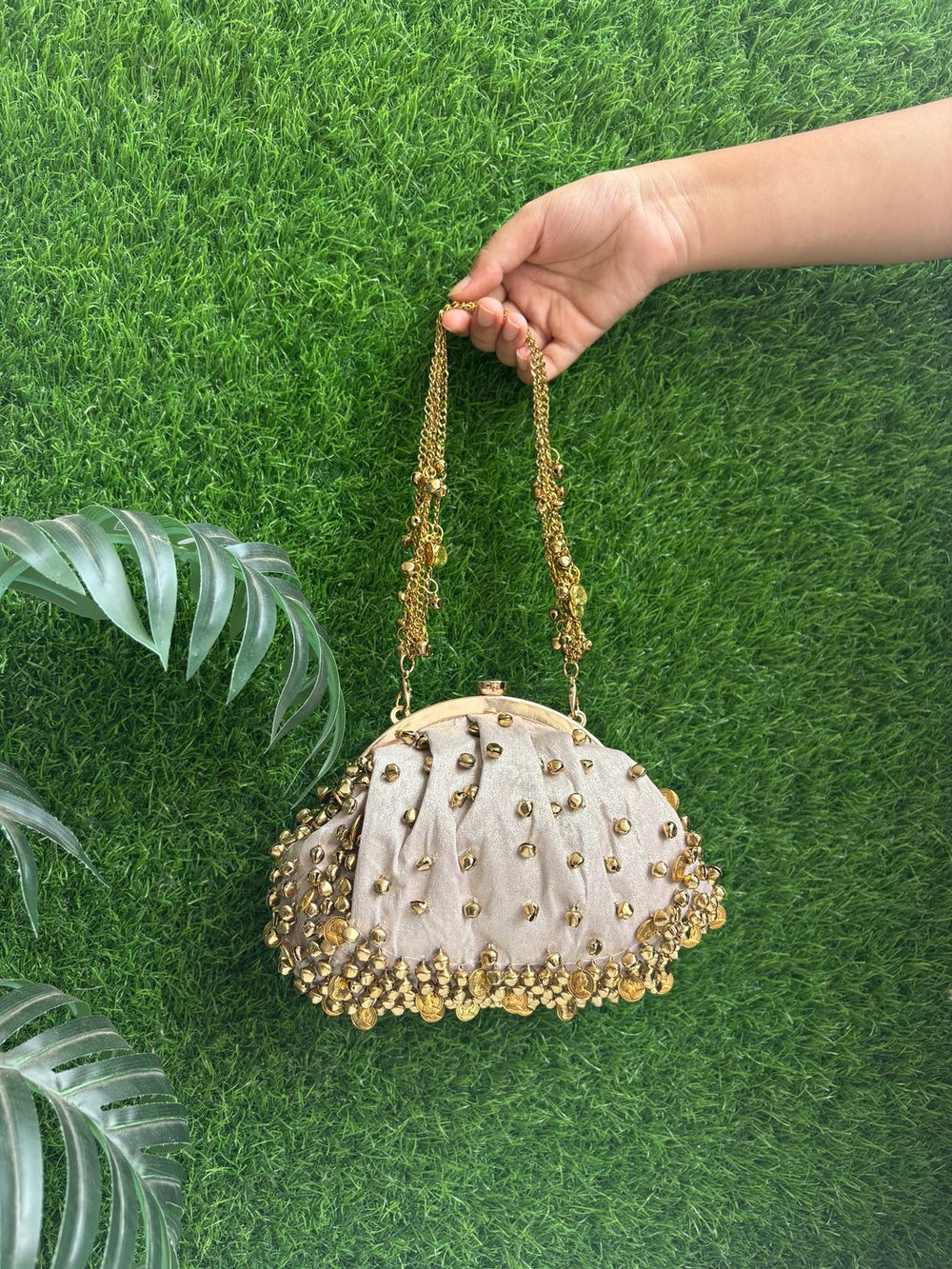 Designer potli clutch with ghungroo detailing