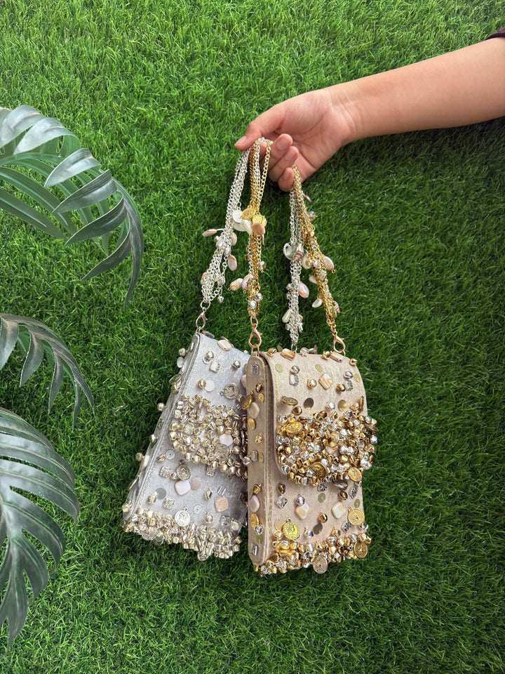 Designer ethnic phone bag with ghungroo detailing in a metallic finish