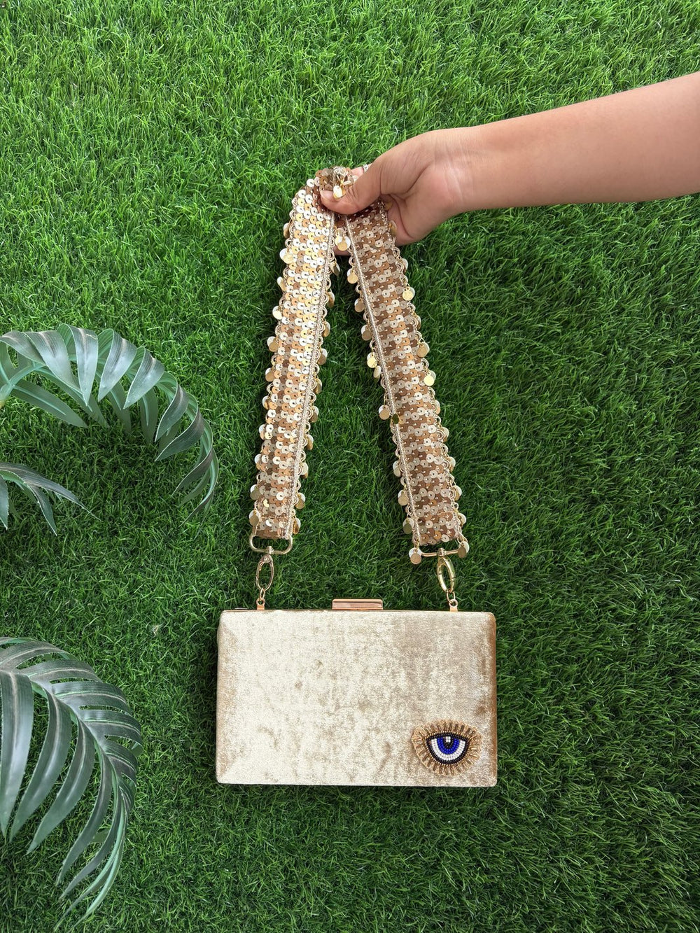 Golden sequin belt clutch bag with personalised initial charm by Potli Ghar