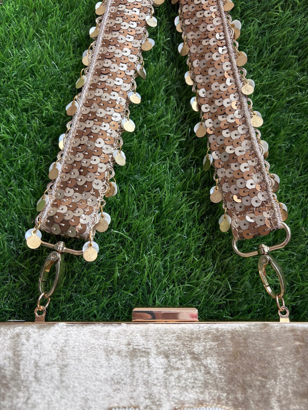 Gold evening clutch with embellished sequin belt and initial charm