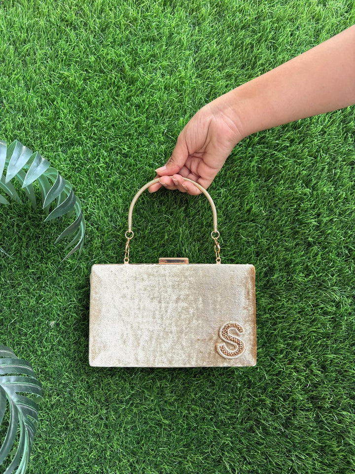 Golden party clutch with statement belt strap and customised initial