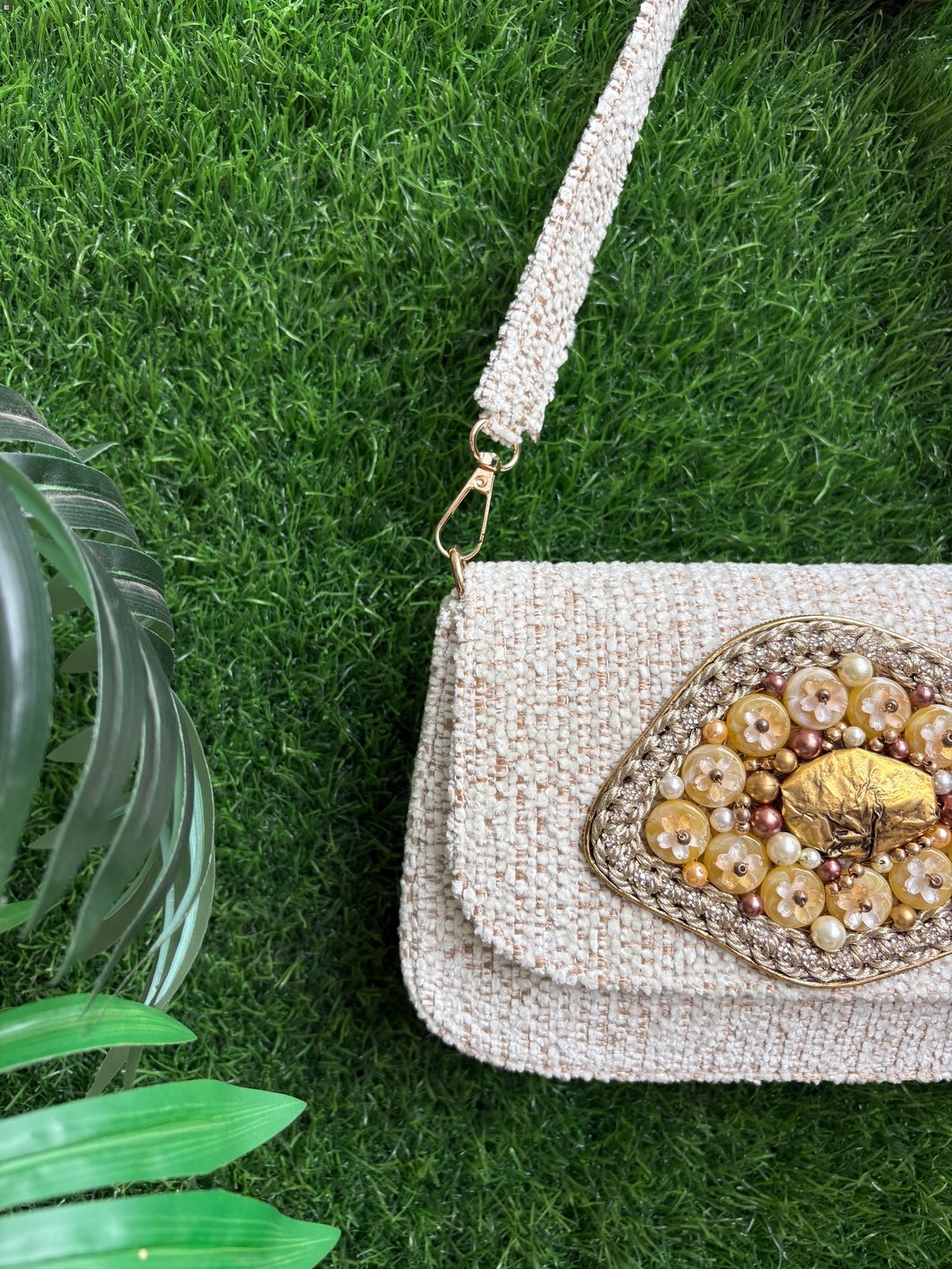 Heritage Bloom Evening Clutch in ivory tweed with handcrafted floral embellishment