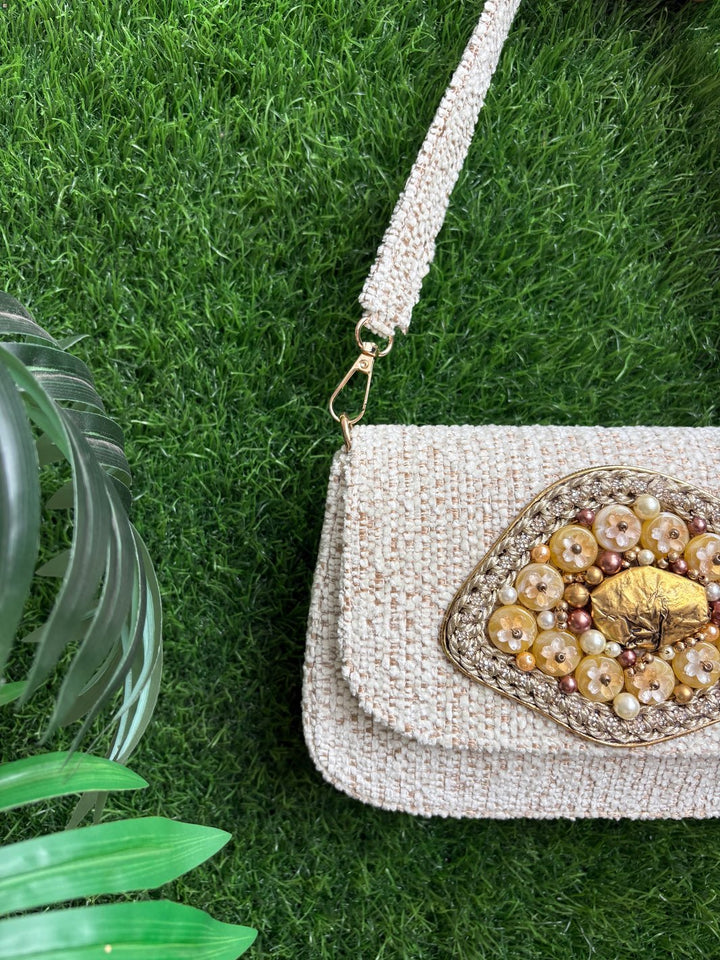 Heritage Bloom Evening Clutch in ivory tweed with handcrafted floral embellishment