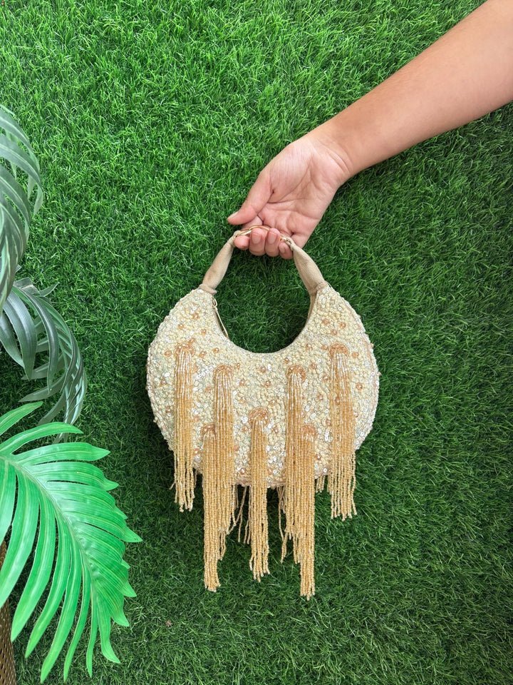 Golden Intricate Tassel Detailing Potli Clutch with Handcrafted Embroidery