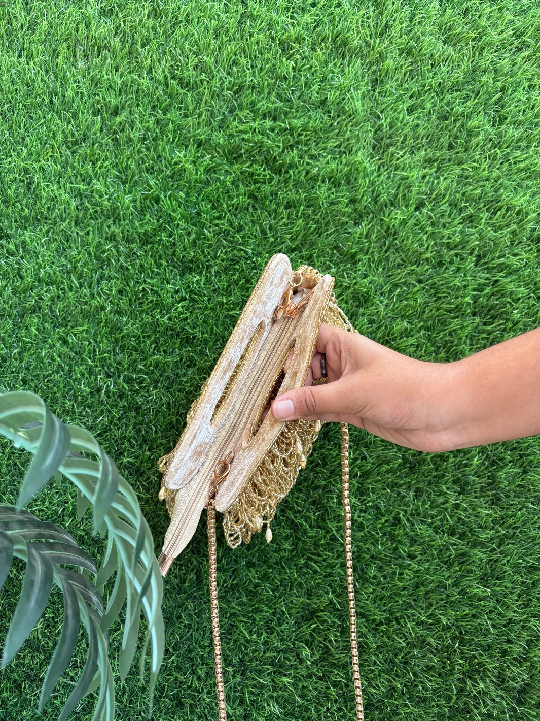 Golden tasselled clutch with zip for weddings