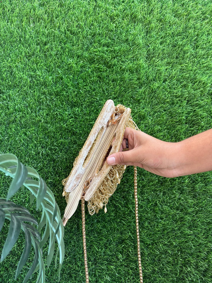 Golden tasselled clutch with zip for weddings