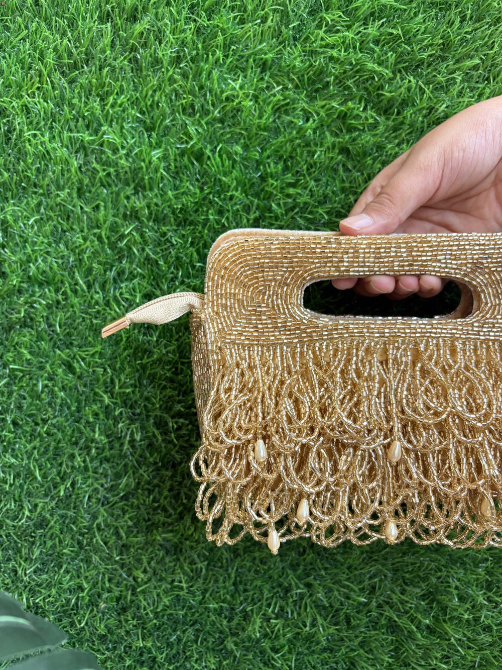 Golden tasselled clutch for weddings