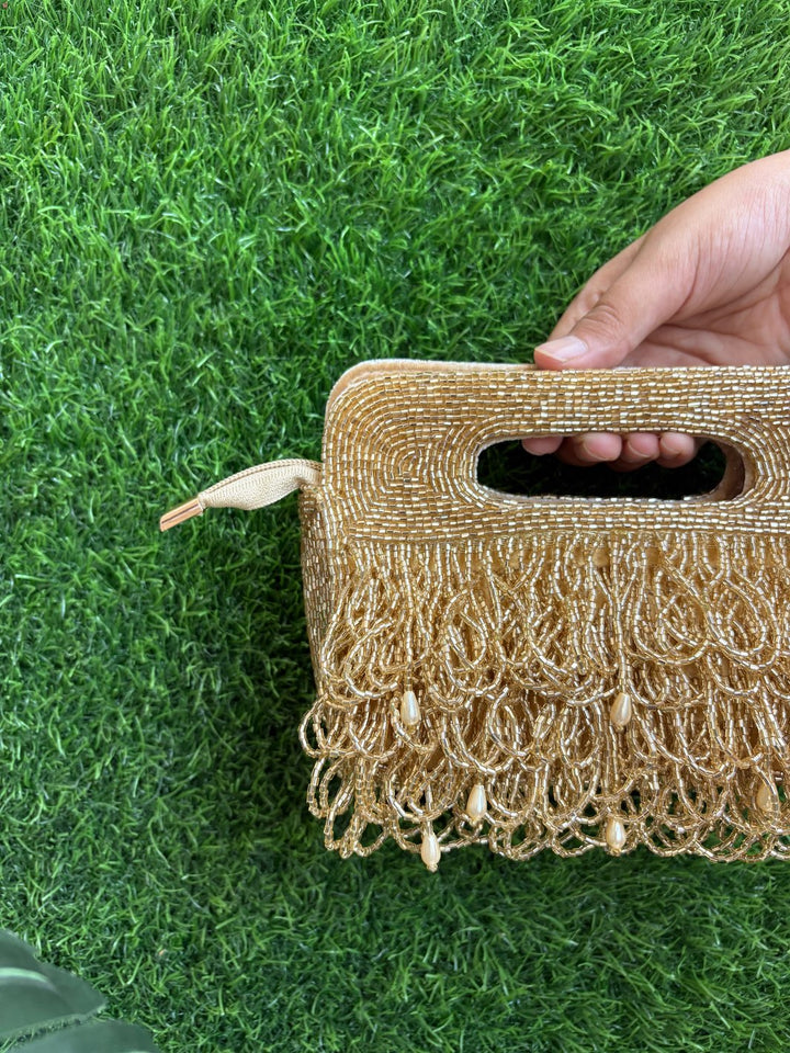Golden tasselled clutch for weddings