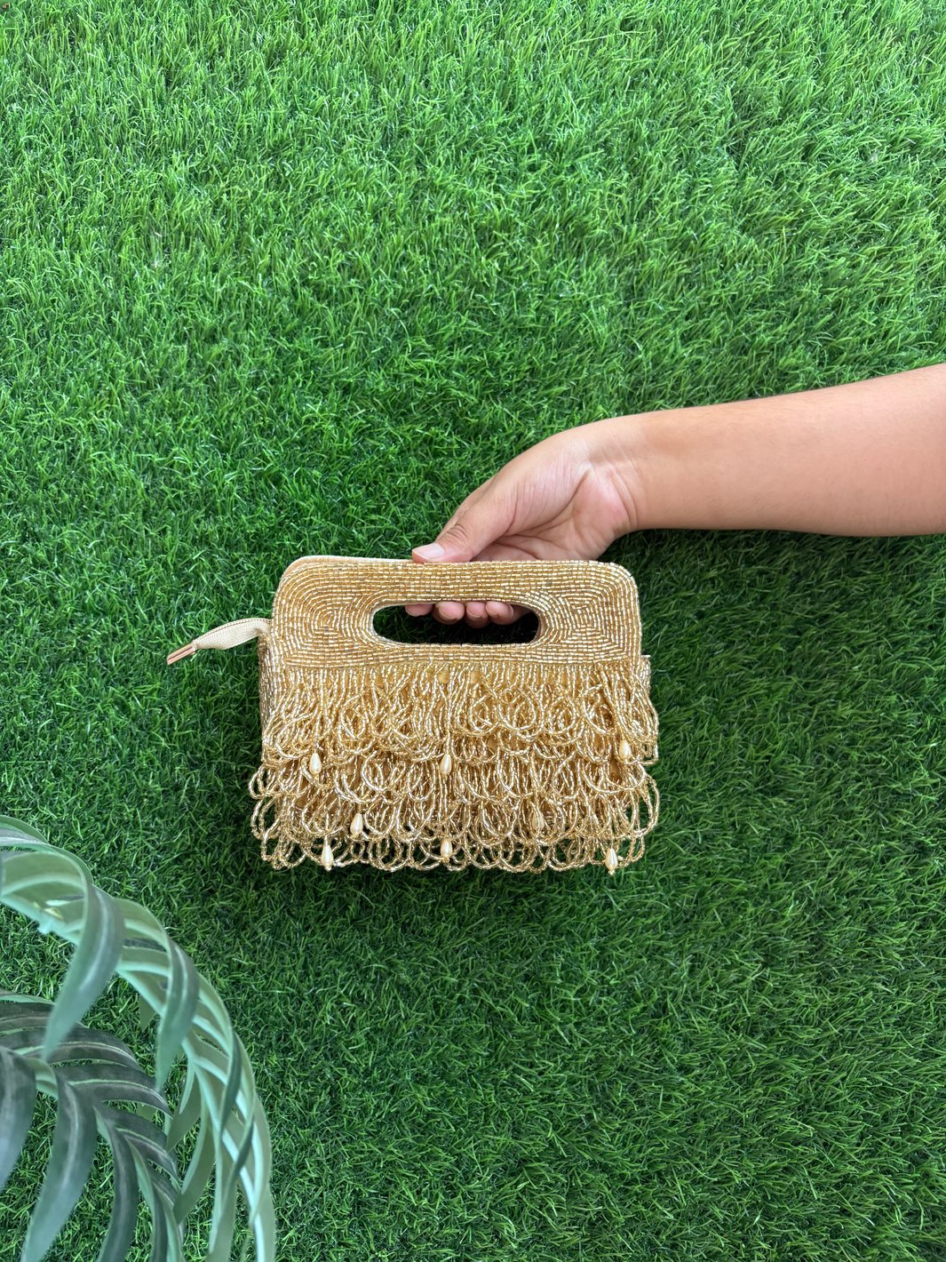 Golden tasselled clutch for weddings