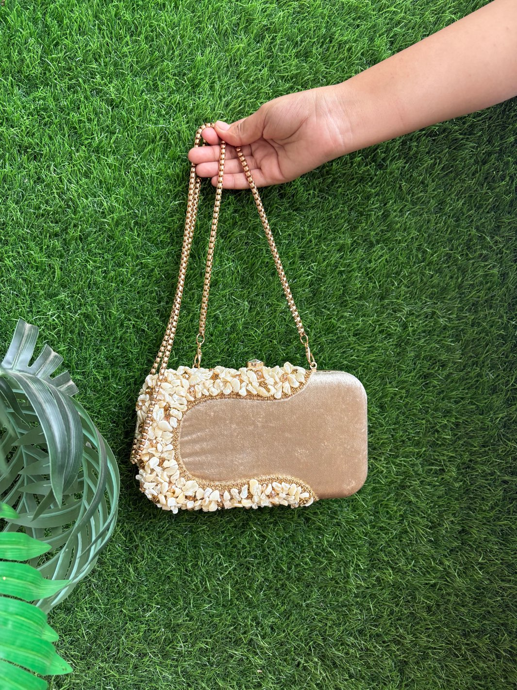Golden evening clutch with embellished front design