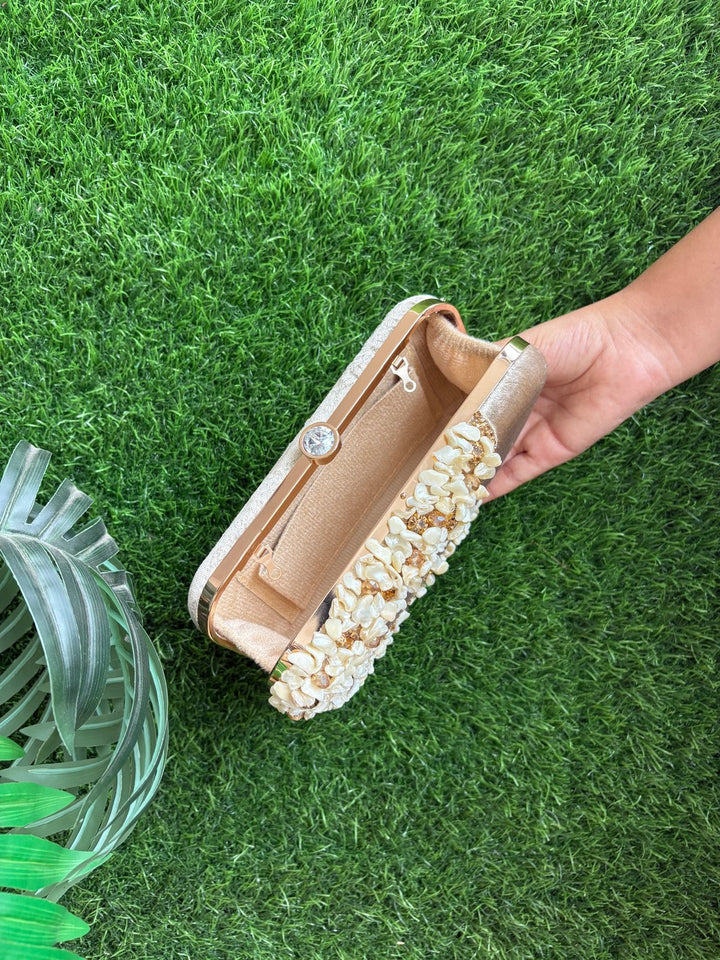 Light golden party wear clutch with elegant top handle
