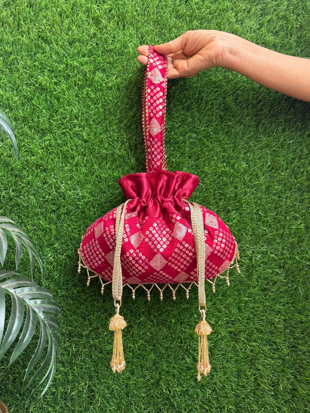 Dark red Noor Potli for weddings and festive occasions