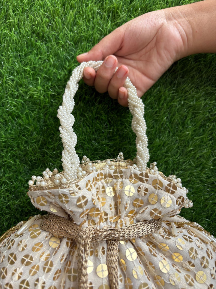 White and gold embellished potli bag with pearl detailing