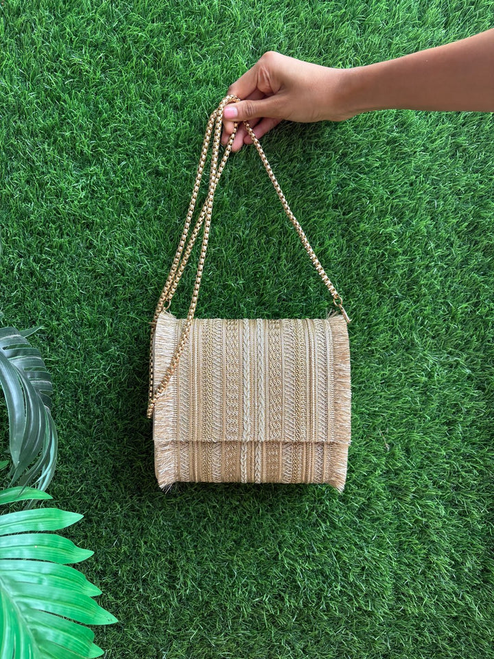 Embellished handle detail of Premium Gold Ethnic Clutch Bag