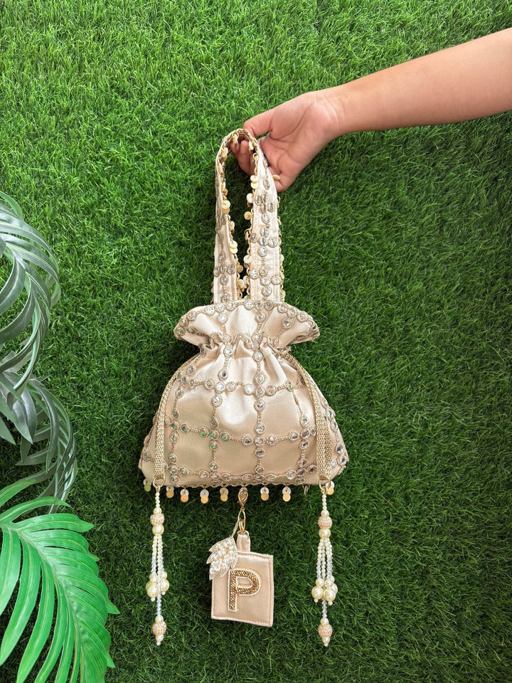 Royal Cutwork Gold Potli with Customised Initial Charm