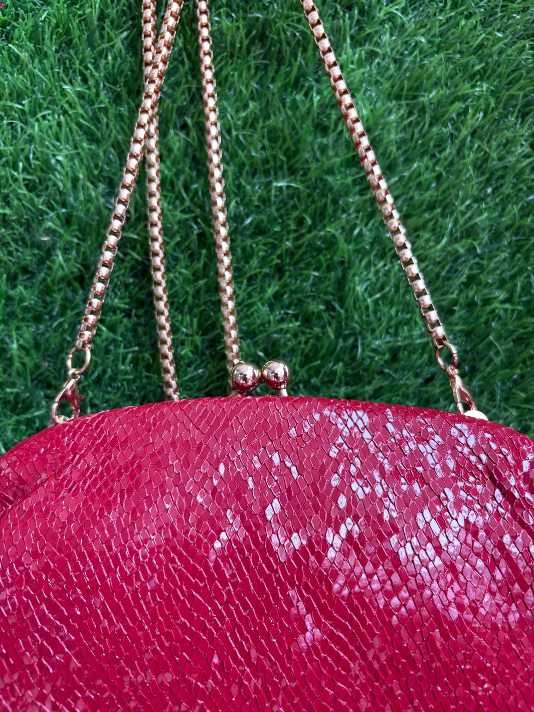 Red textured clutch bag for weddings and festive occasions