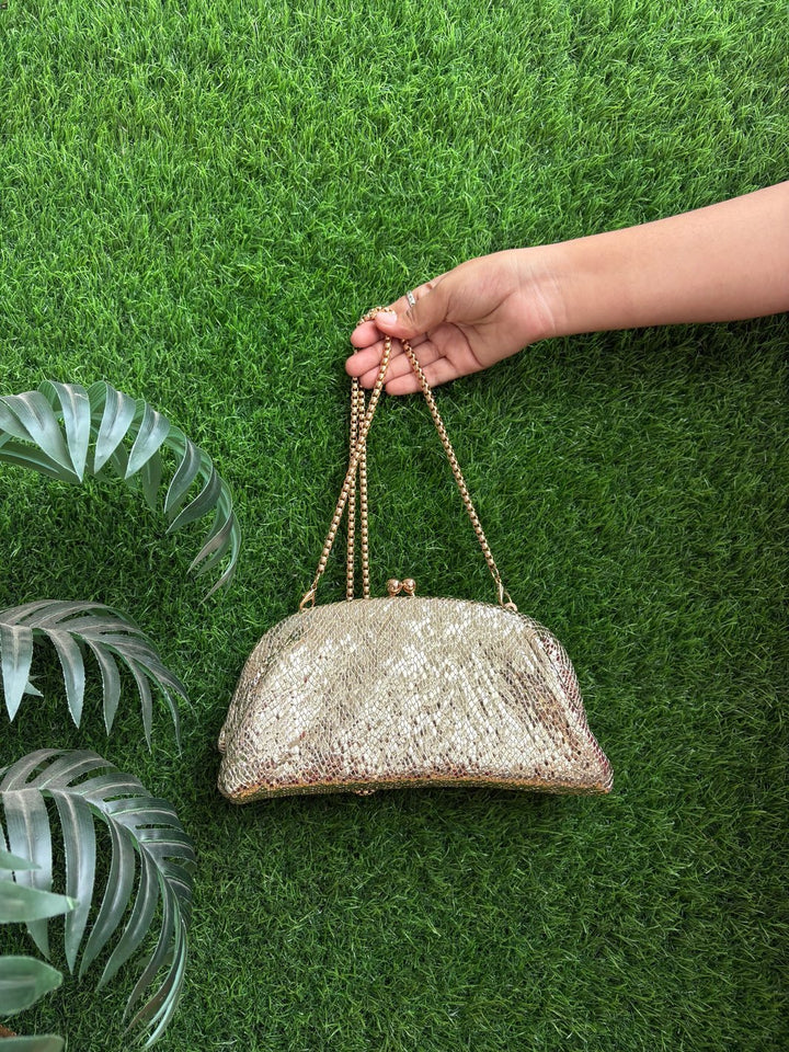 Textured Half-Frame Clutch bag with metal frame closure and sling chain