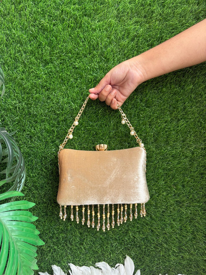 Back view of ivory gold Crystal Bloom wedding clutch with crystal fringe