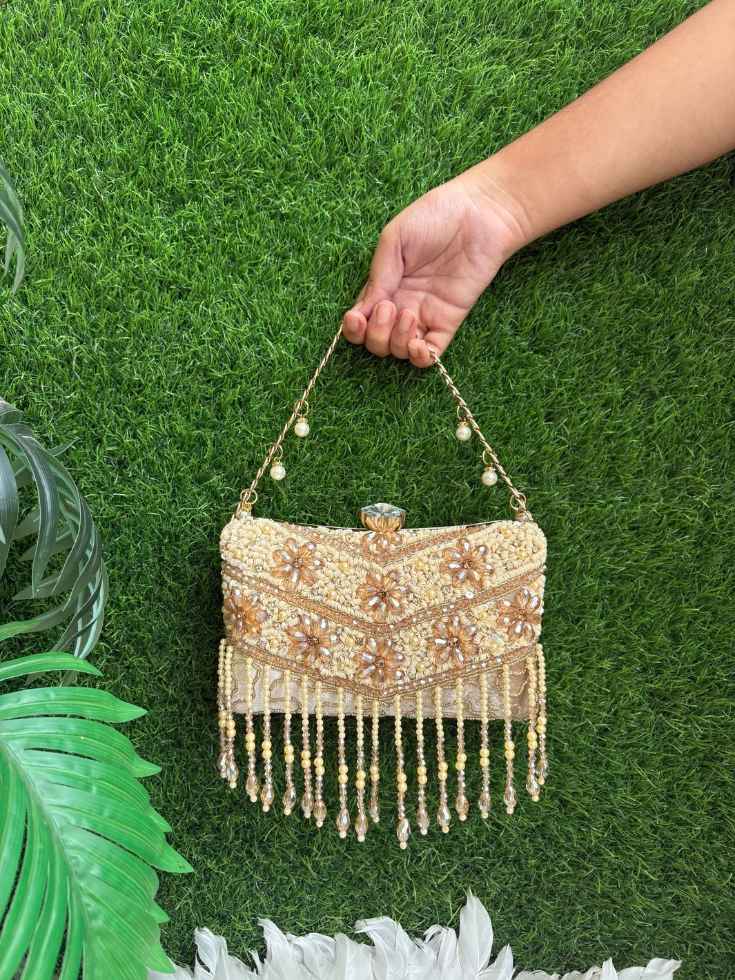 The Crystal Bloom Clutch ivory gold wedding clutch with floral detailing and crystal fringe