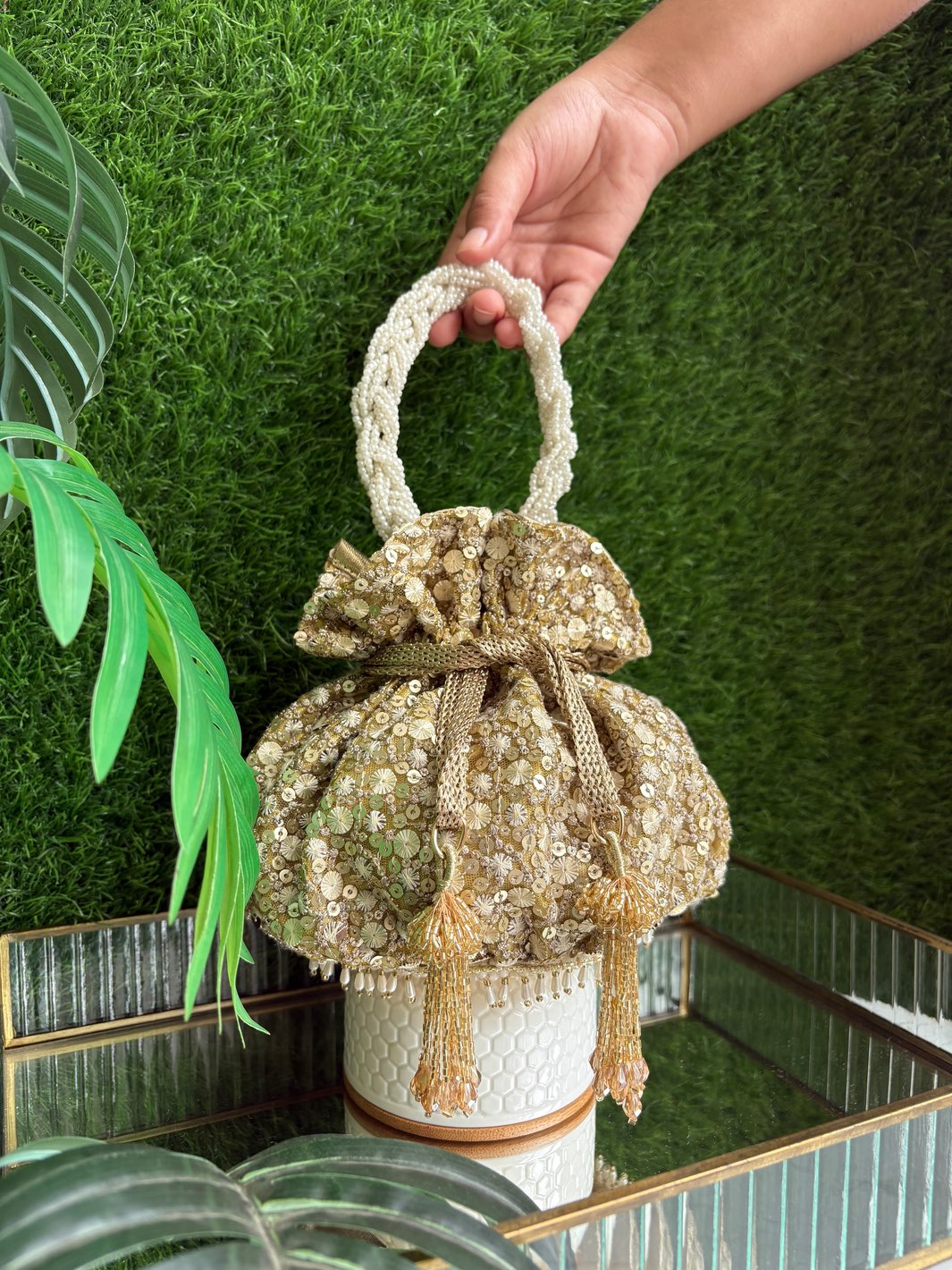 The Golden Affair Potli gold designer potli bag with pearl handle and tassels