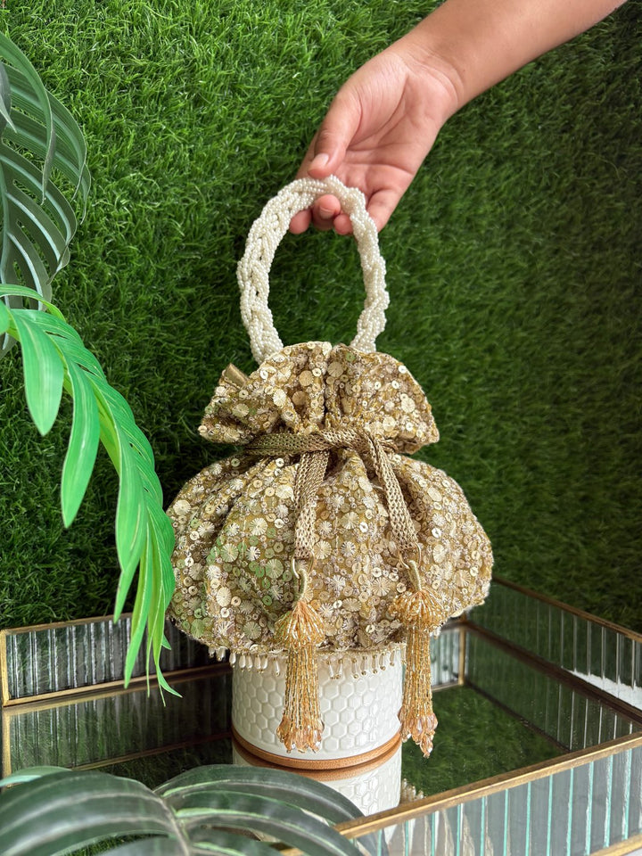 The Golden Affair Potli gold designer potli bag with pearl handle and tassels