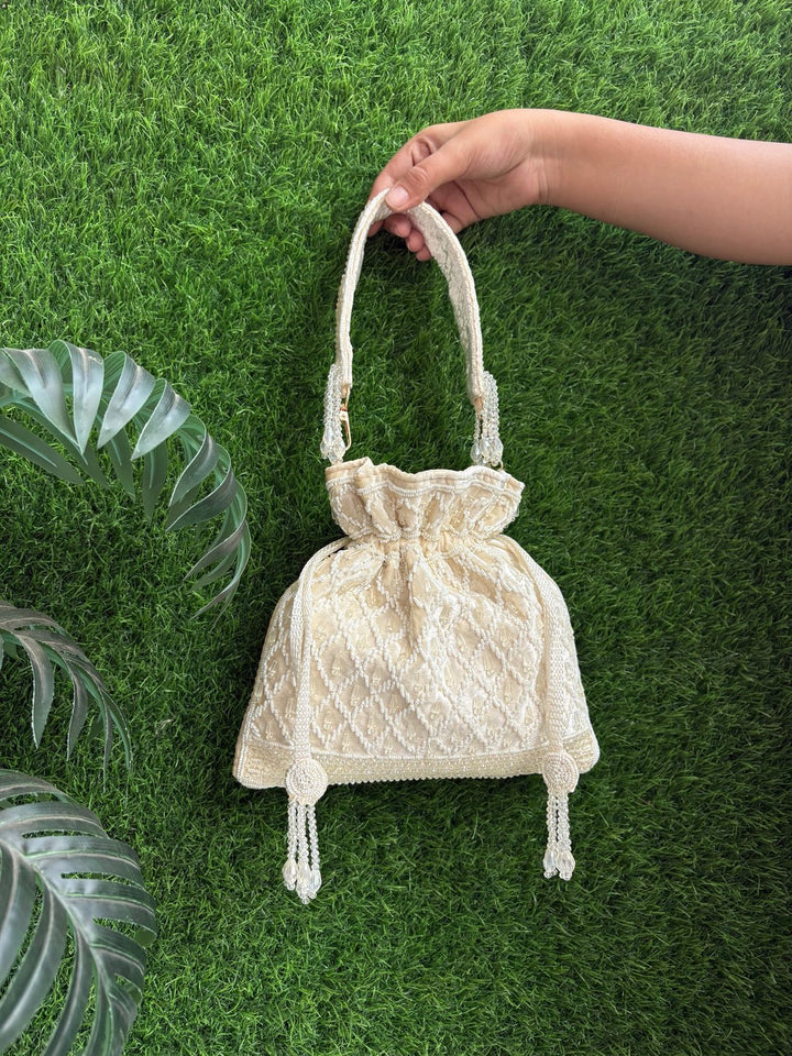 Handcrafted velvet potli bag for weddings and festive occasions