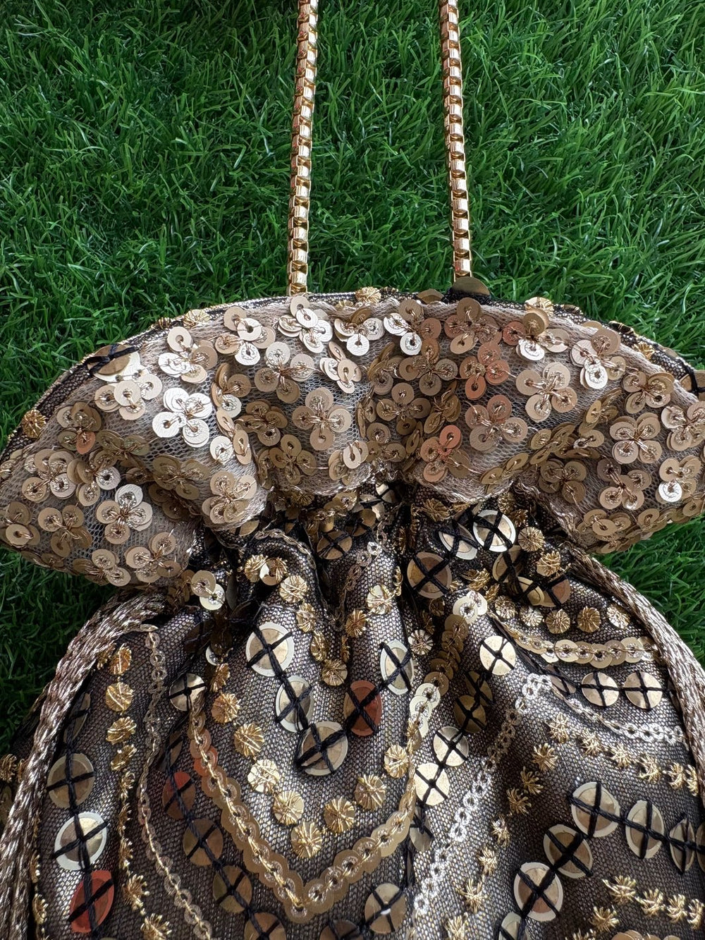 Designer black potli bag with intricate artwork by The Potli Ghar