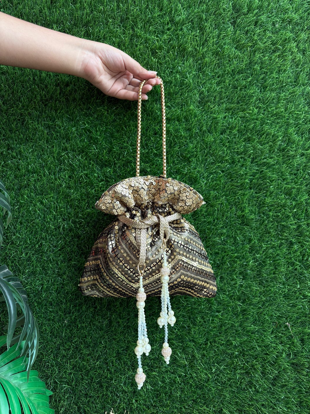 Black artwork potli for women with chain handle and handcrafted detailing