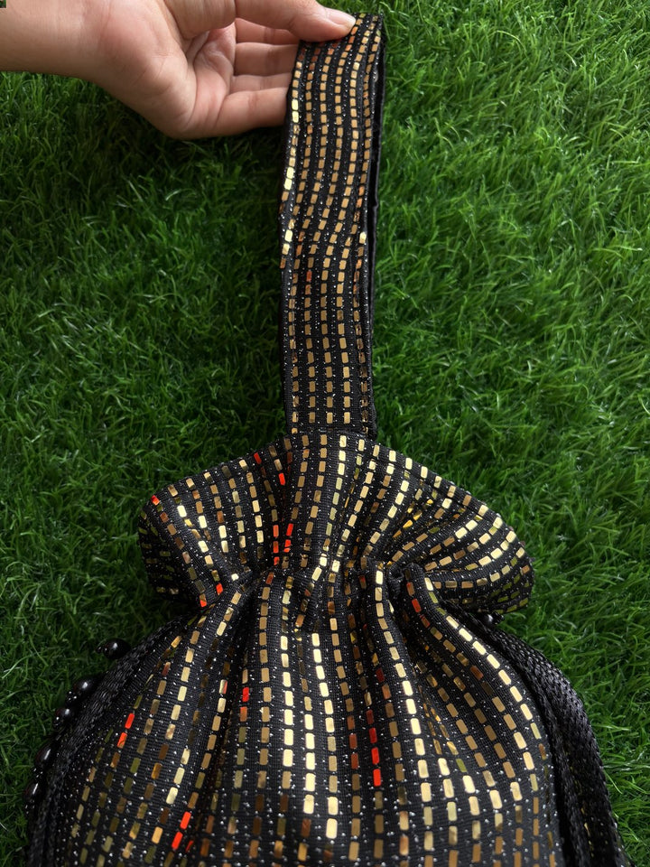 Elegant black potli bag with shimmer detailing by The Potli Ghar